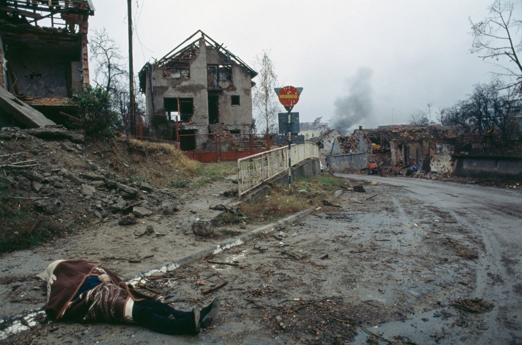 The corpse of a civilian lies in the deserted street near bombed buildings after a three-month battle between the Croatian armed forces and the Yugoslavian Federal Army in Vukovar. The Yugoslavian Federal Army completely destroyed the Croatian city and dropped 600 to 800 missiles per day, killing thousands of civilians., Image: 15114607, License: Rights-managed, Restrictions: Content available for editorial use, pre-approval required for all other uses. This content may not be materially modified or used in composite content., Model Release: no, Credit line: Profimedia, Corbis